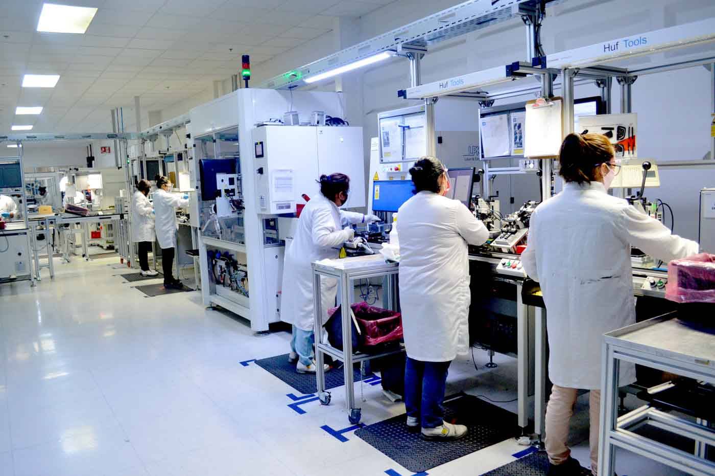 People working at production line of Huf Mexico in Puebla