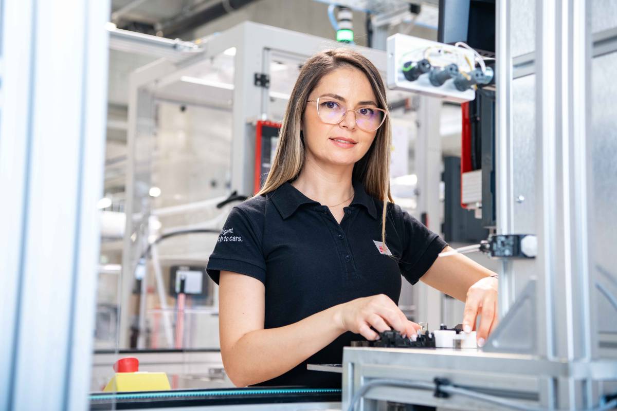 Young women working at Huf plant in Arad romania on car keys